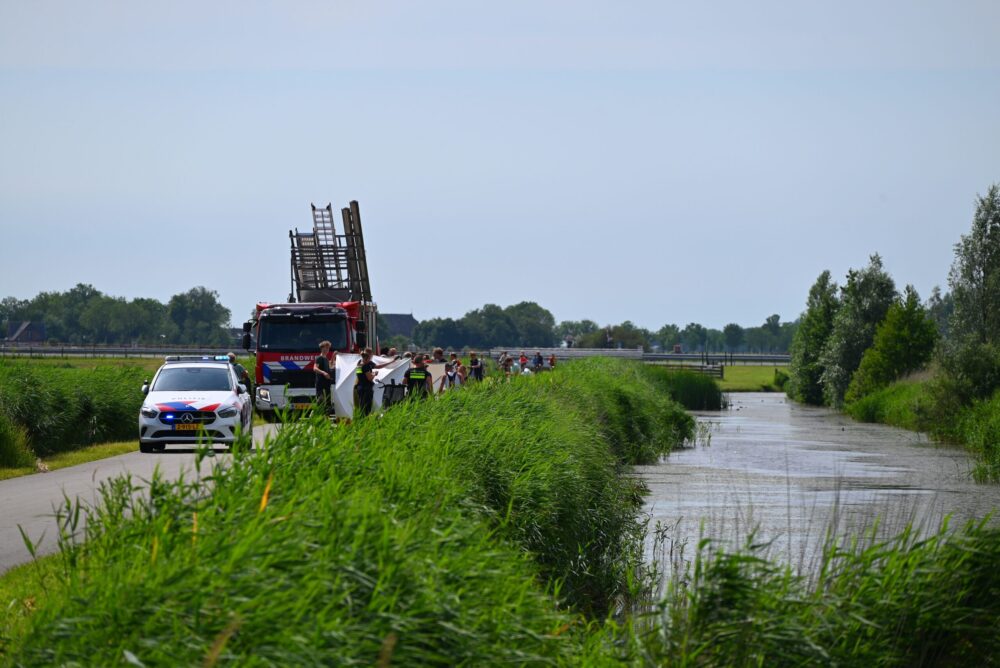 Persoon op driewielfiets te water in Jellum